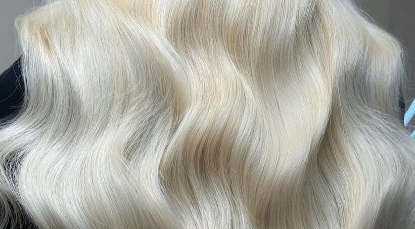 Luxurious silky blonde hair at Luxe Hair, Aberdeen, Scotland, GB, showcasing expert styling and color.
