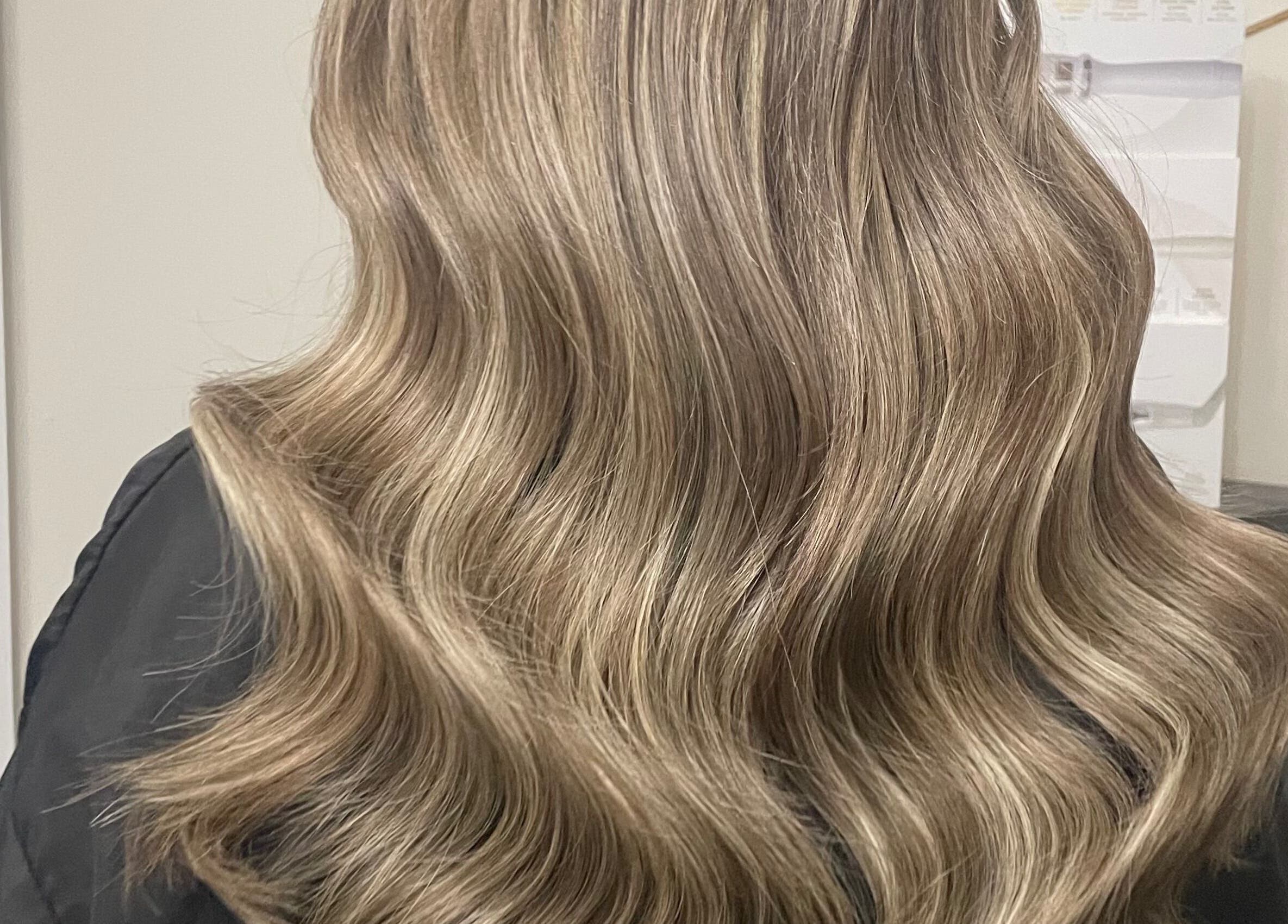 Elegant blonde waves styled at Luxe Hair in Aberdeen, Scotland, GB.