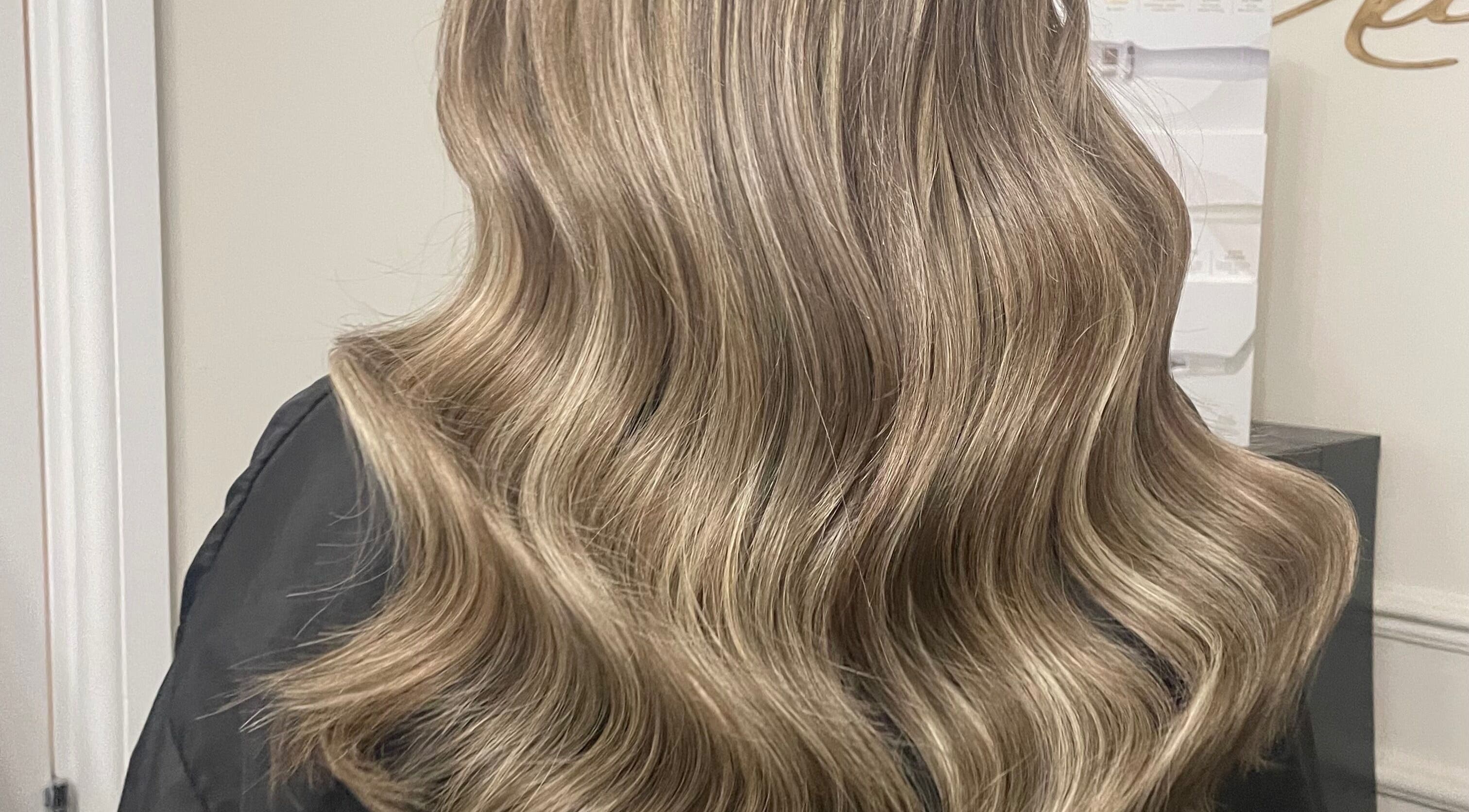 Elegant blonde waves styled at Luxe Hair in Aberdeen, Scotland, GB.