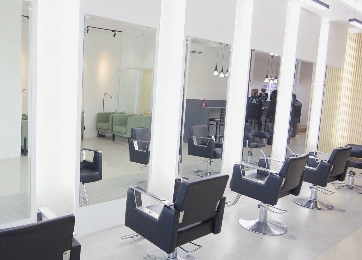Modern salon interior at HelloMello Salon in Angeles, Central Luzon, PH with sleek styling chairs and mirrors.