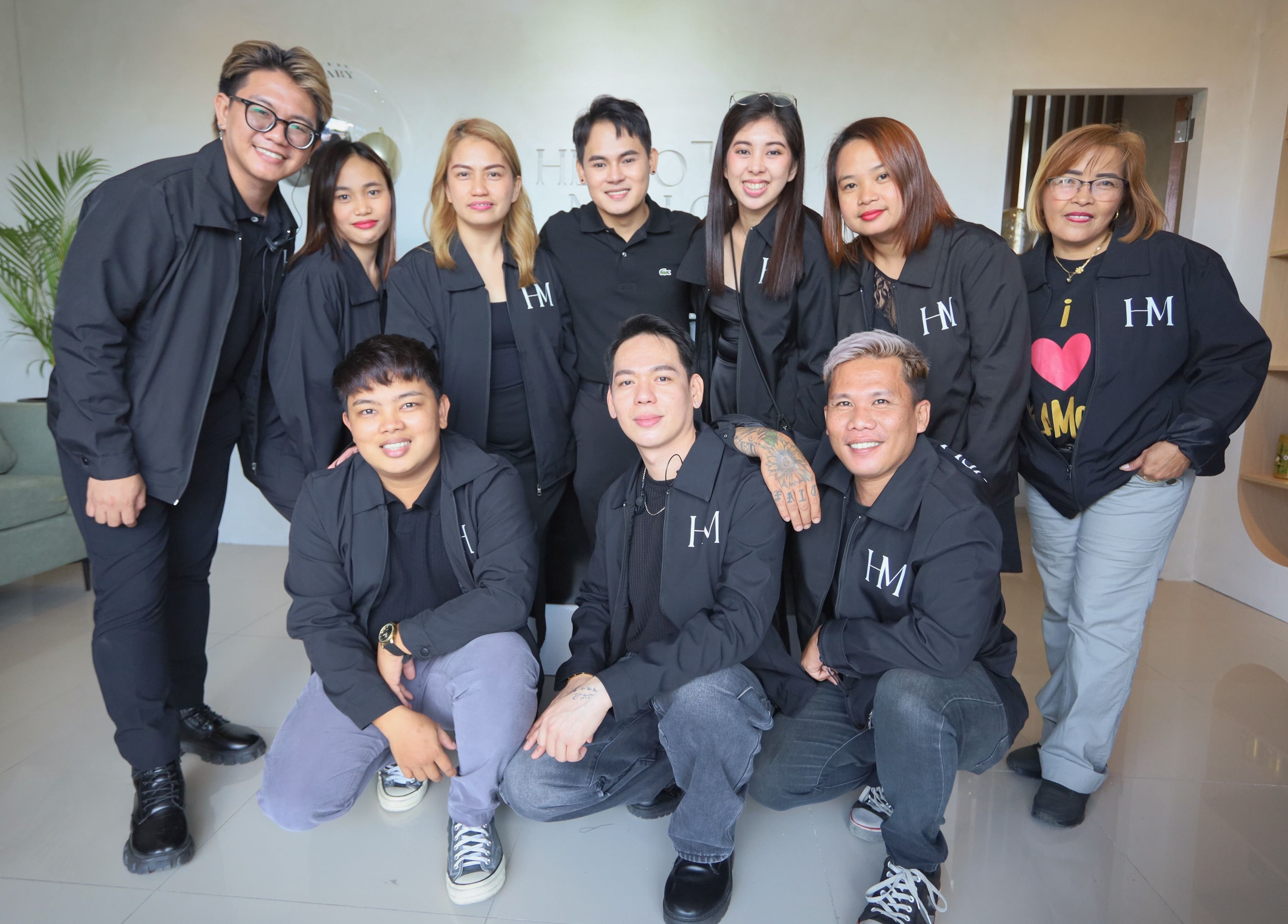 Team photo at HelloMello Salon in Angeles, Central Luzon, PH, showcasing professional staff with smiles.