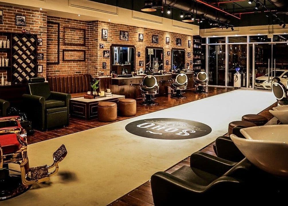 Chic interior of Soho Vintage Barbers on Sheikh Zayed Road, Dubai, Dubai, AE, featuring stylish chairs and decor.