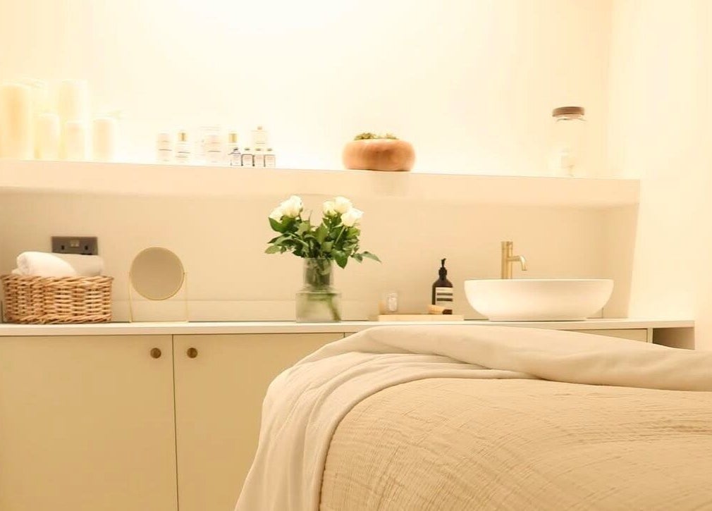 Serene treatment room at WESTERHAM, Kent, England, GB, featuring cozy linens and elegant decor.