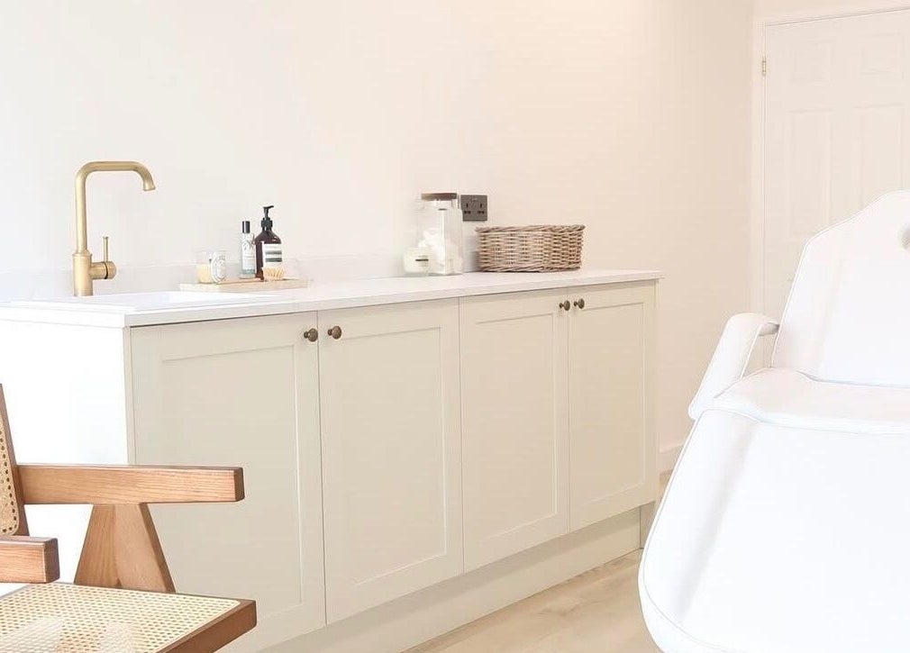 Elegant beauty treatment room at WESTERHAM, Kent, England, GB with cozy chair and stylish cabinetry.