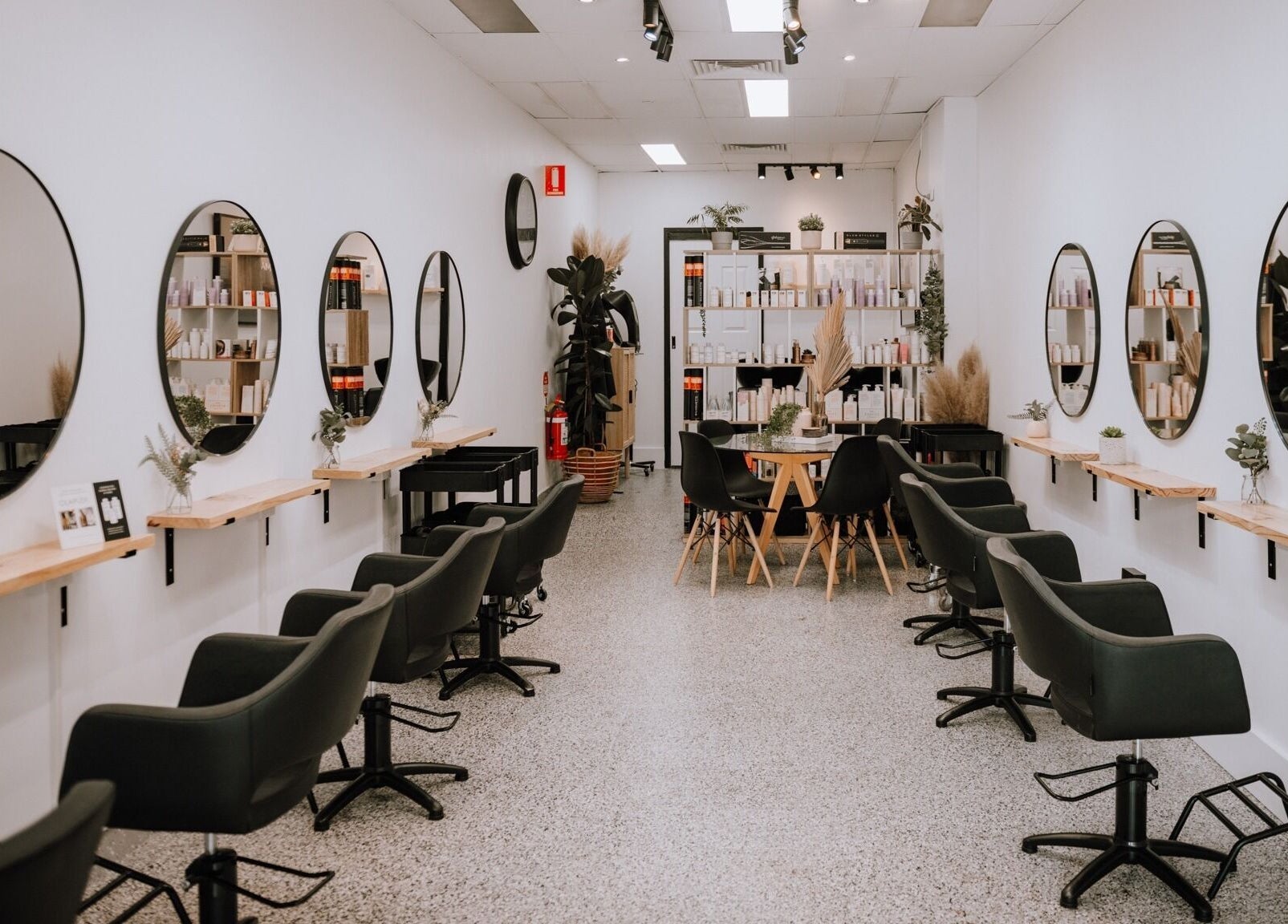 Inside Equal Image Salon in Penrith, New South Wales, with sleek chairs and mirrors.