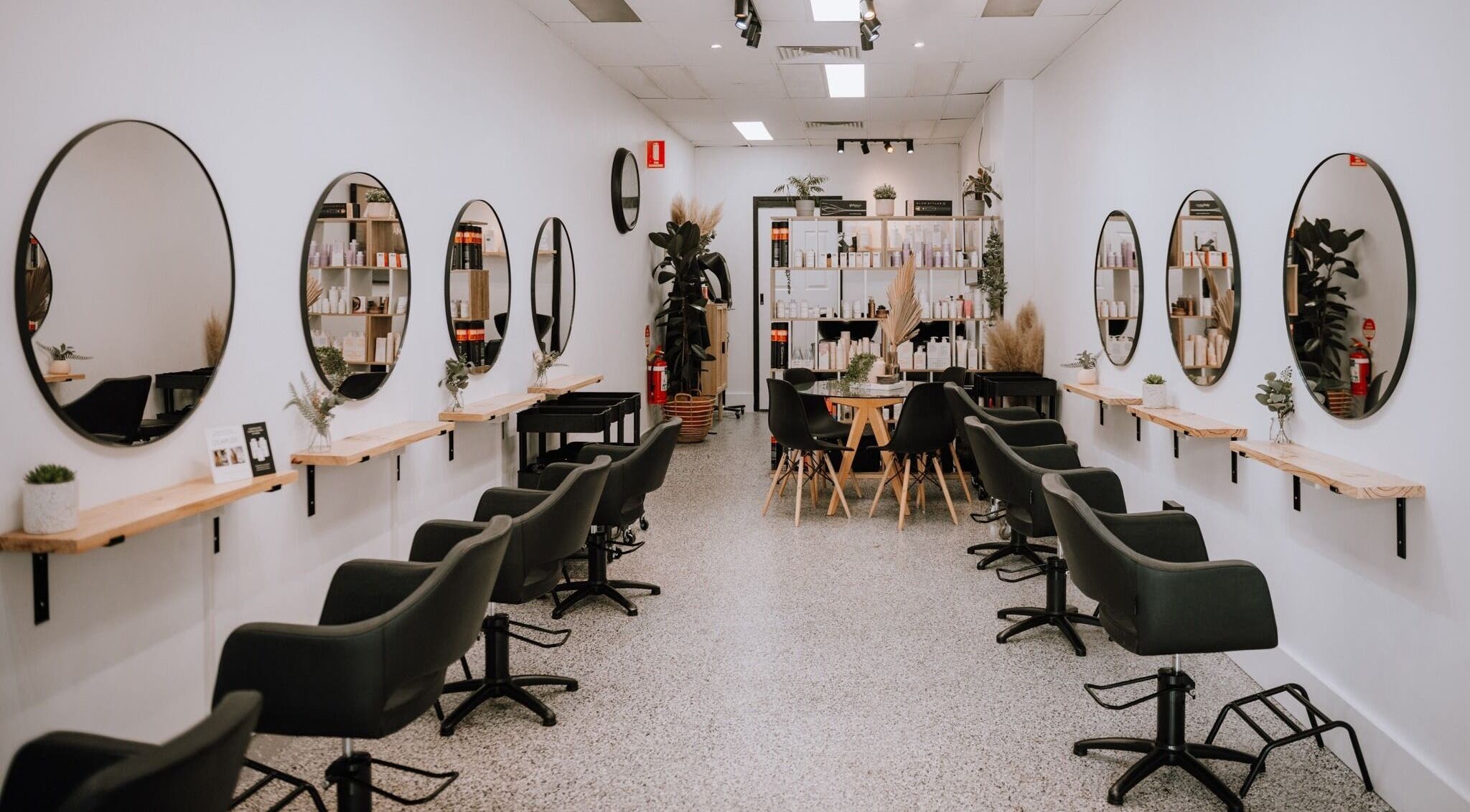 Inside Equal Image Salon in Penrith, New South Wales, with sleek chairs and mirrors.