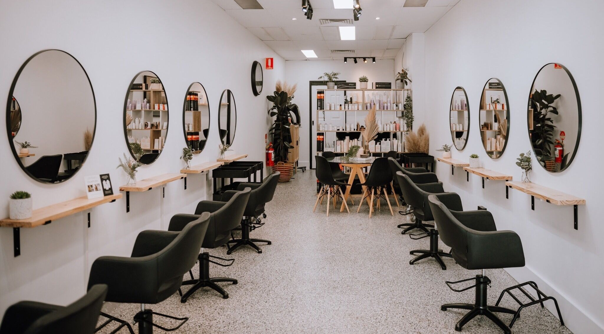 Inside Equal Image Salon in Penrith, New South Wales, with sleek chairs and mirrors.