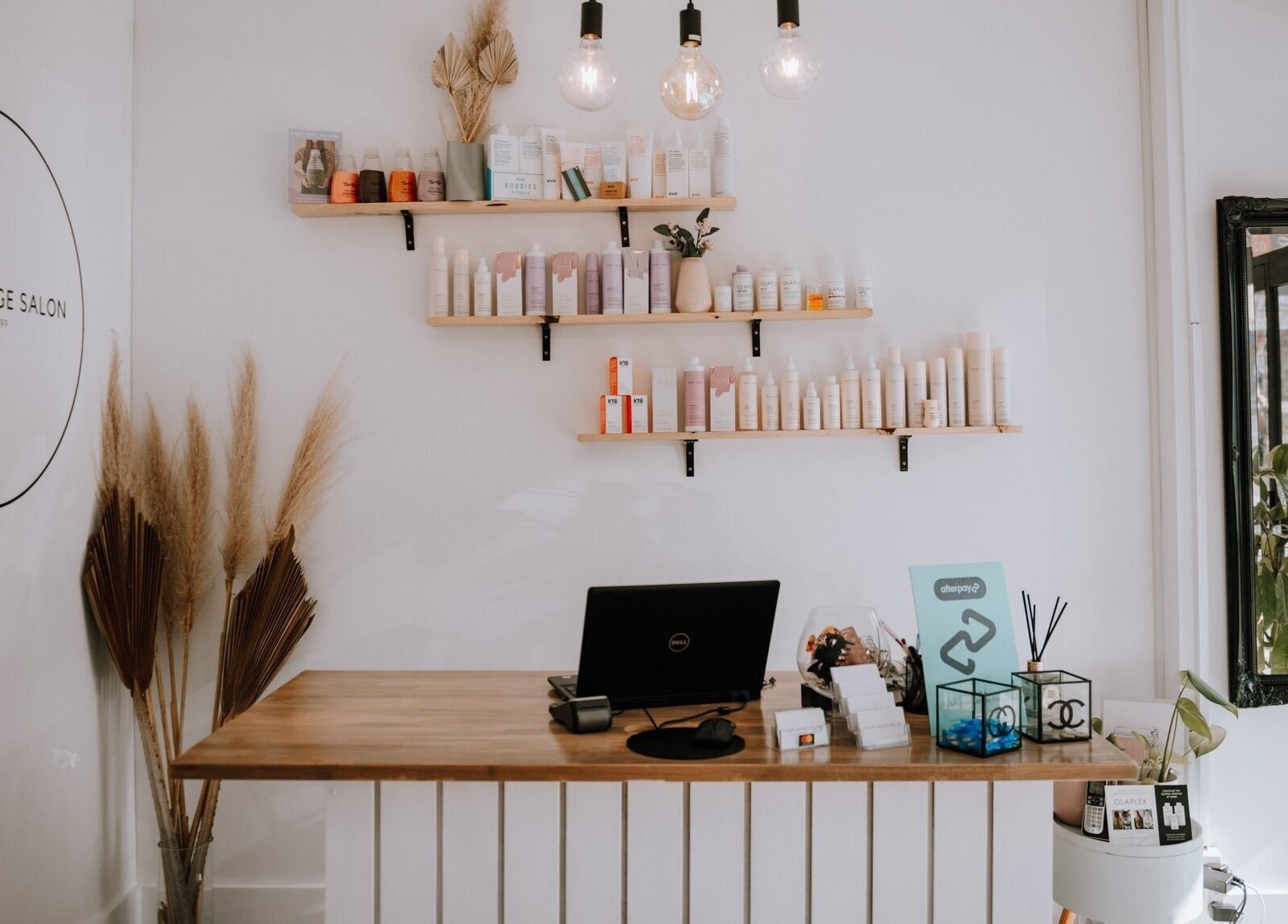 Reception area at Equal Image Salon, Penrith, NSW, featuring stylish decor and beauty products.