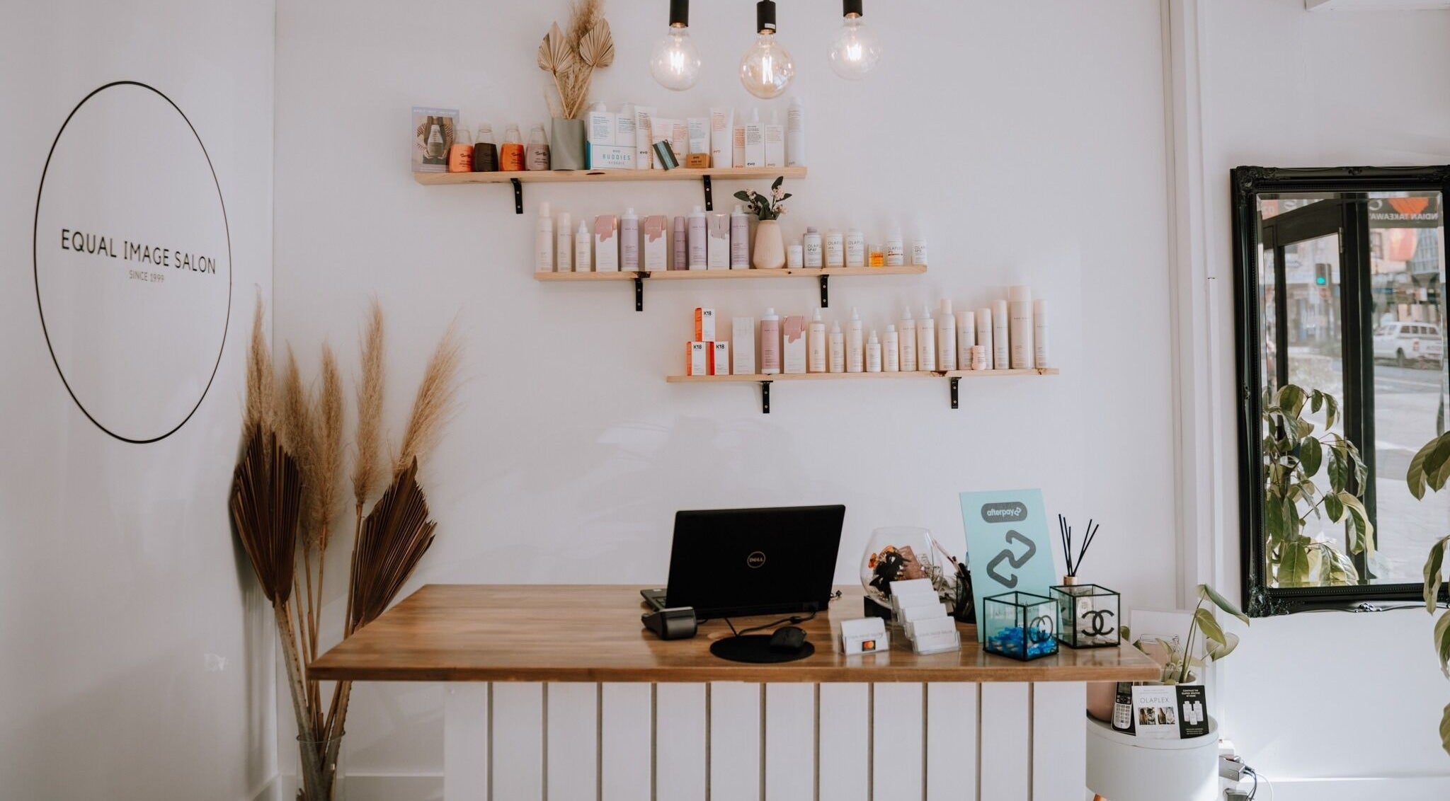 Reception area at Equal Image Salon, Penrith, NSW, featuring stylish decor and beauty products.