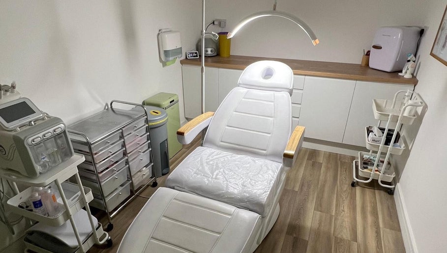 Treatment room at Skin South Wales in Trethomas, Wales, GB featuring a modern spa chair and sleek equipment.