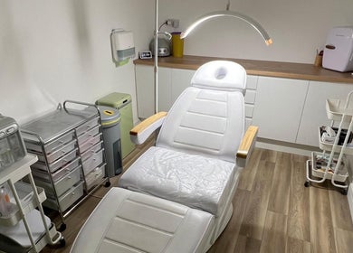 Treatment room at Skin South Wales in Trethomas, Wales, GB featuring a modern spa chair and sleek equipment.