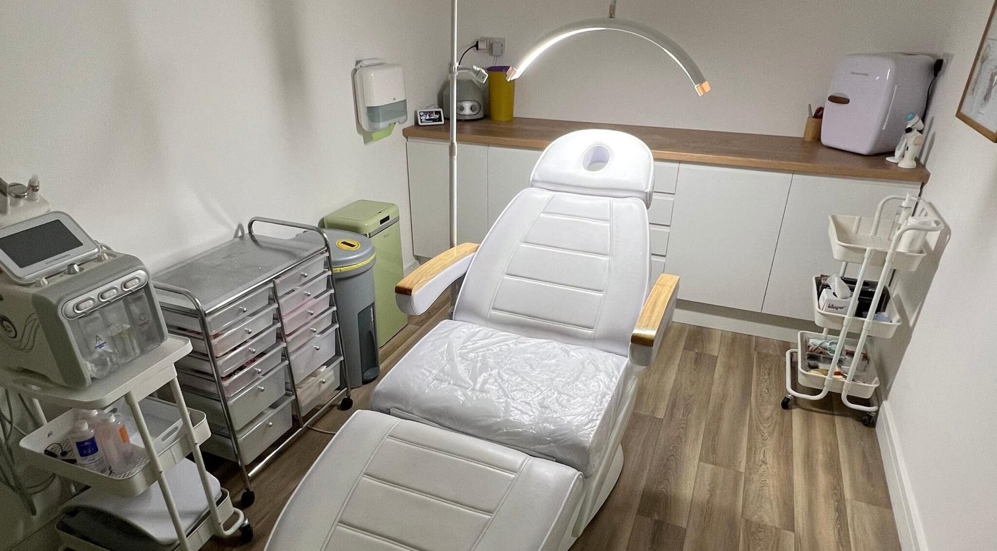 Treatment room at Skin South Wales in Trethomas, Wales, GB featuring a modern spa chair and sleek equipment.