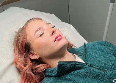 Client enjoying a facial treatment at Skin South Wales in Trethomas, Wales, GB for a rejuvenating experience.