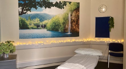 Relaxing spa room at UCLH Staff Only Spa, London, England, GB featuring calming wall mural and soft lighting.