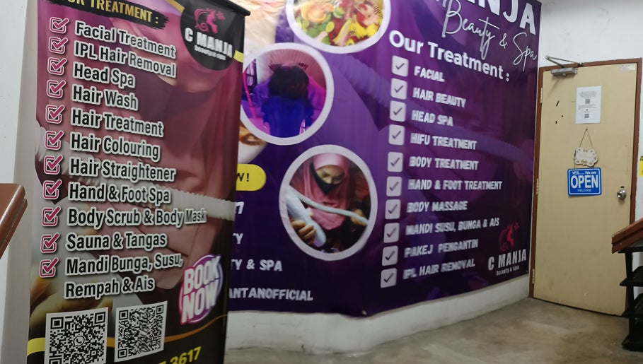 C Manja Beauty & Spa treatment options displayed on wall in Kuantan, Pahang, MY.