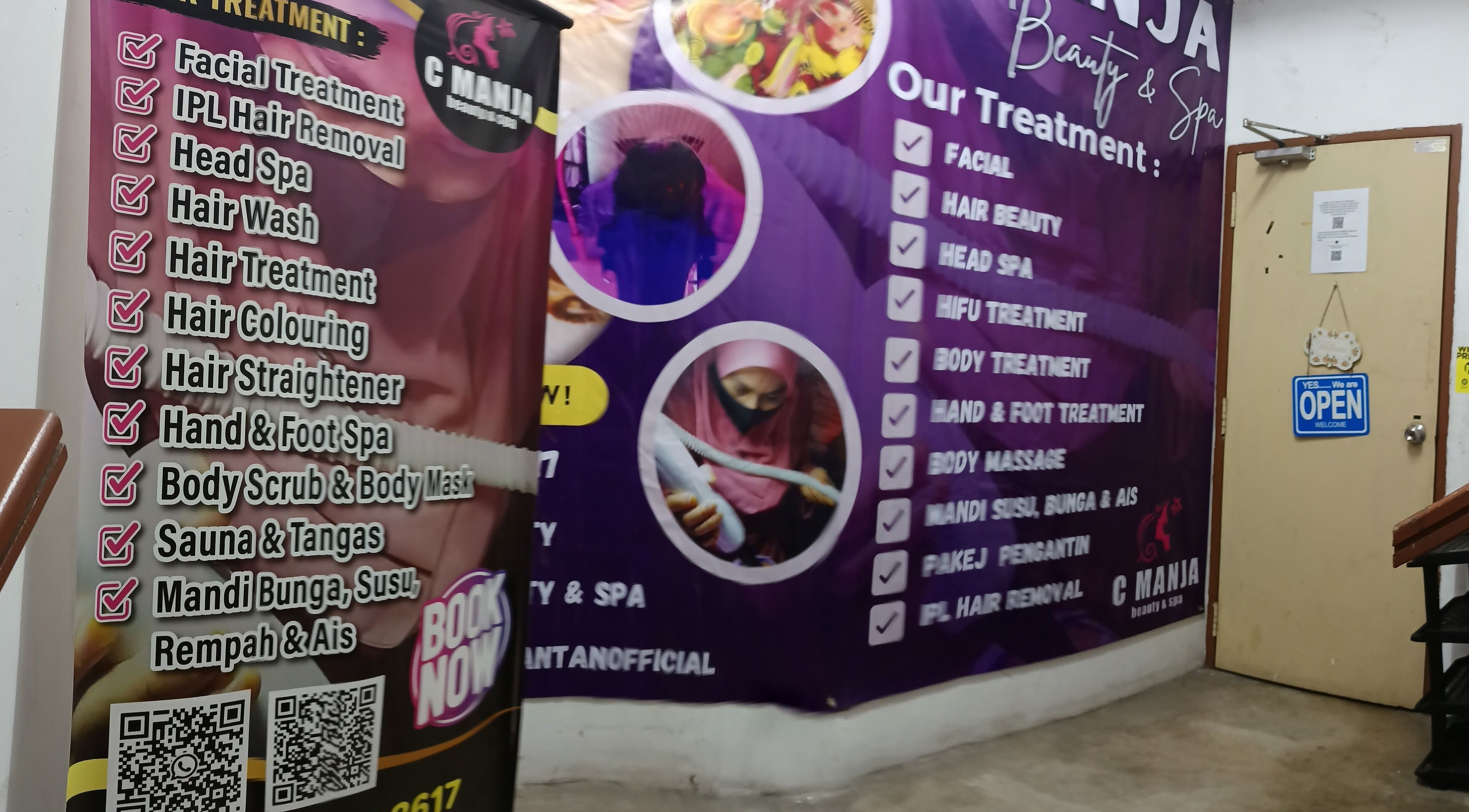 C Manja Beauty & Spa treatment options displayed on wall in Kuantan, Pahang, MY.