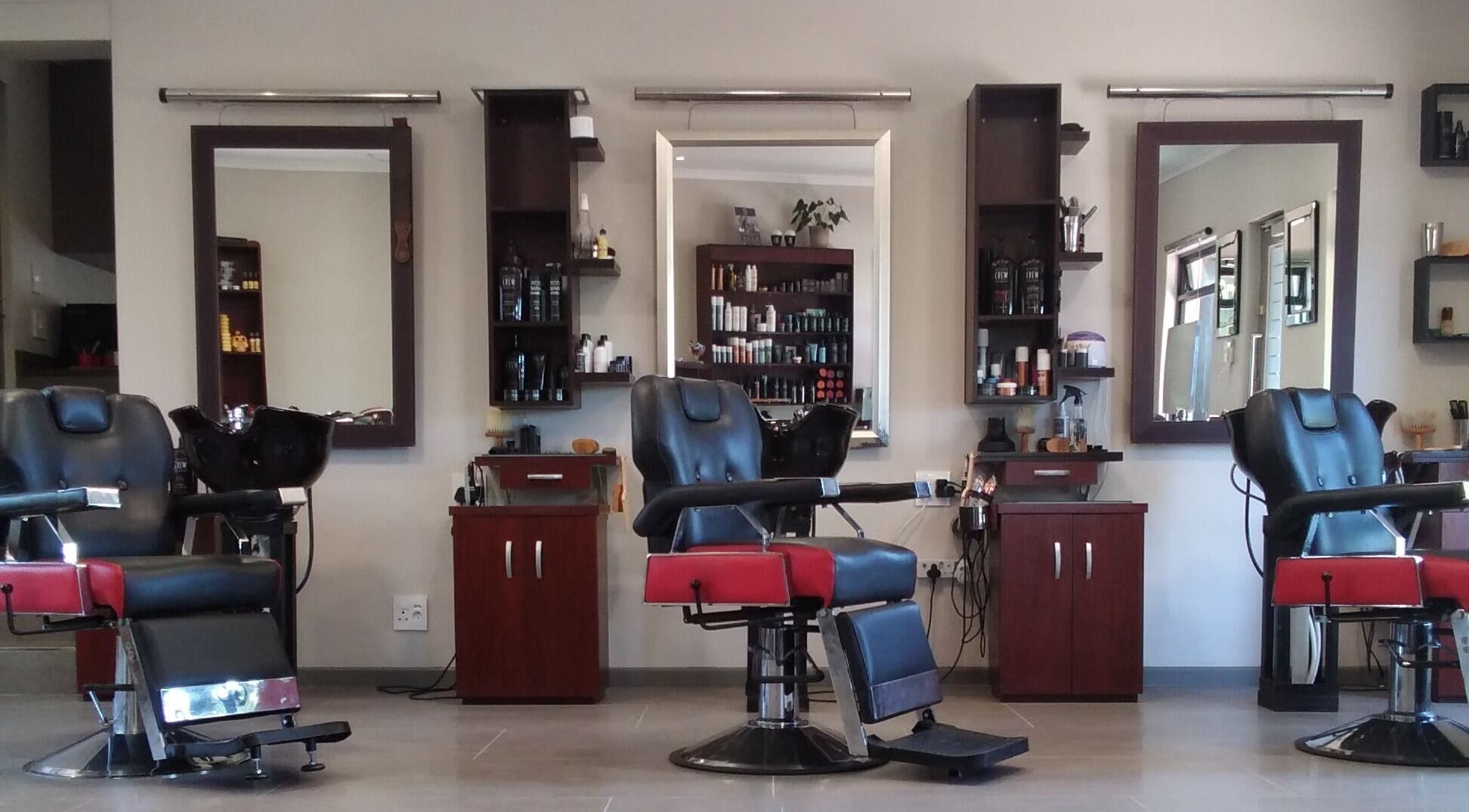 Elegant salon chairs and mirrors at XCO MAN, Cape Town, Western Cape, ZA.