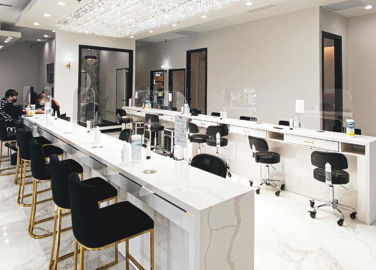 Modern interior of Ava Nail Bar Geneva with elegant seating in Geneva, Illinois, US.