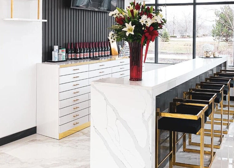 Modern interior of Ava Nail Bar Geneva featuring a chic counter and stylish seating in Geneva, Illinois, US.
