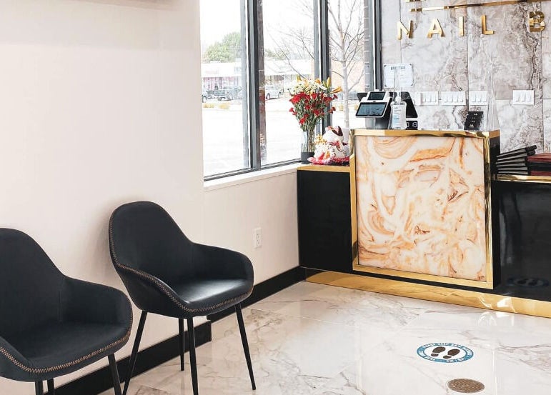 Chic reception at Ava Nail Bar Geneva, Geneva, Illinois, US, featuring modern decor and comfortable seating.