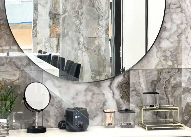 Modern marble vanity with mirror at Ava Nail Bar Geneva, Geneva, Illinois, US.