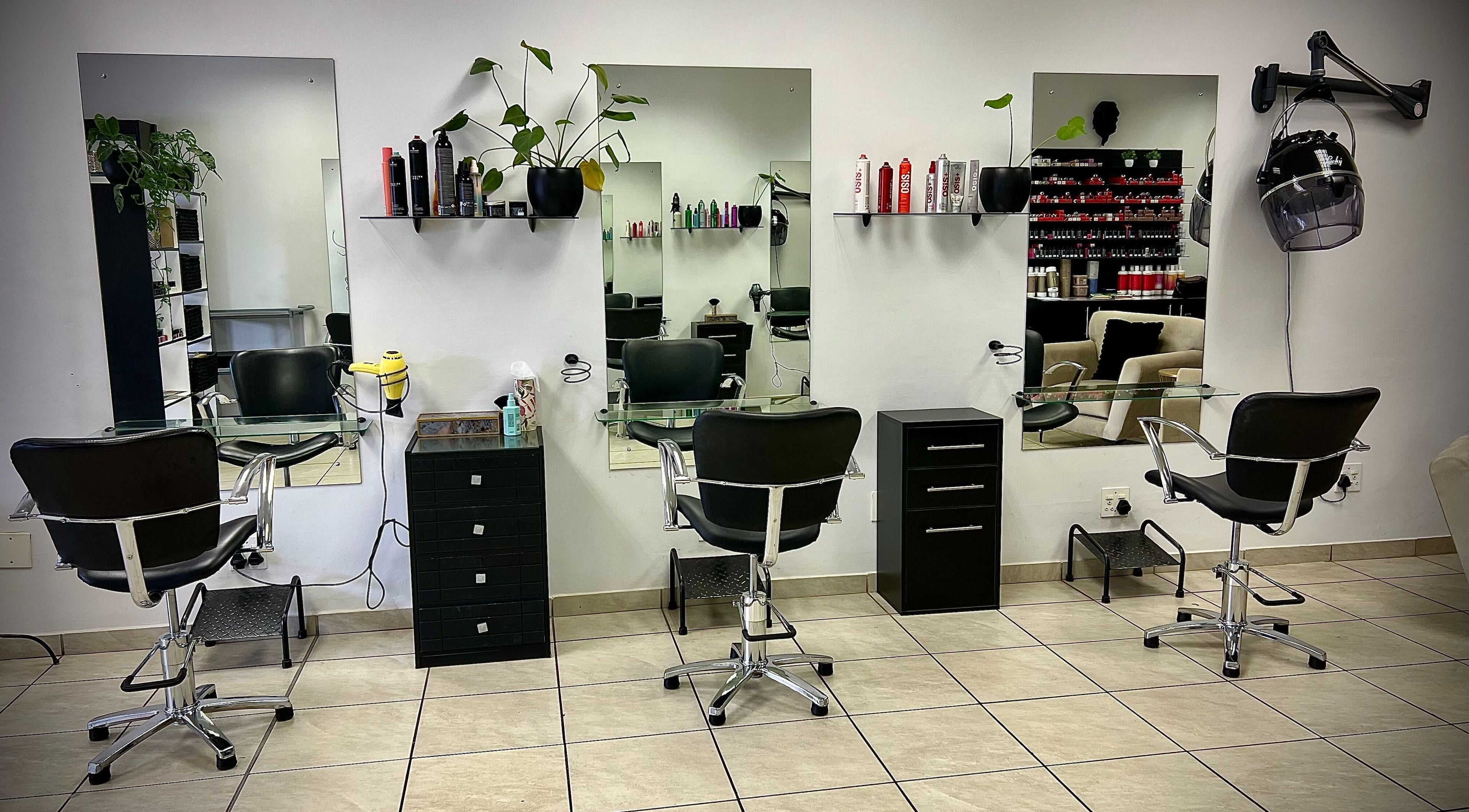 Hey Beautiful Hair Co. salon interior with stylish chairs and mirrors in Pretoria, Gauteng, ZA.