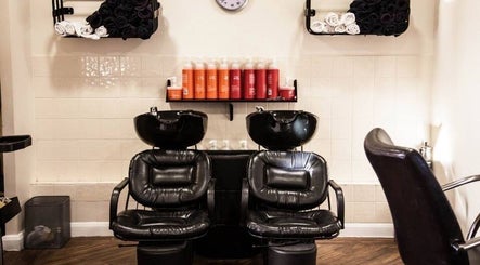 Elegant hair washing station at Escape Hair, Strensall, England, GB with plush chairs and premium products.