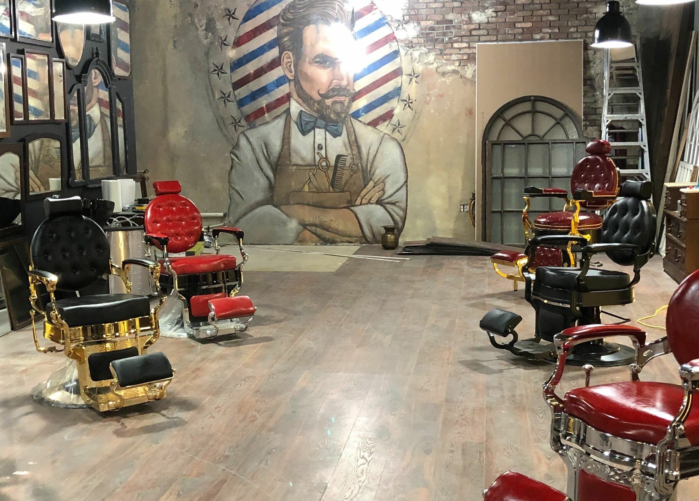 Elegant barber chairs at Vosco’s Barbershop, Logan, Utah, US with a classic mural backdrop.