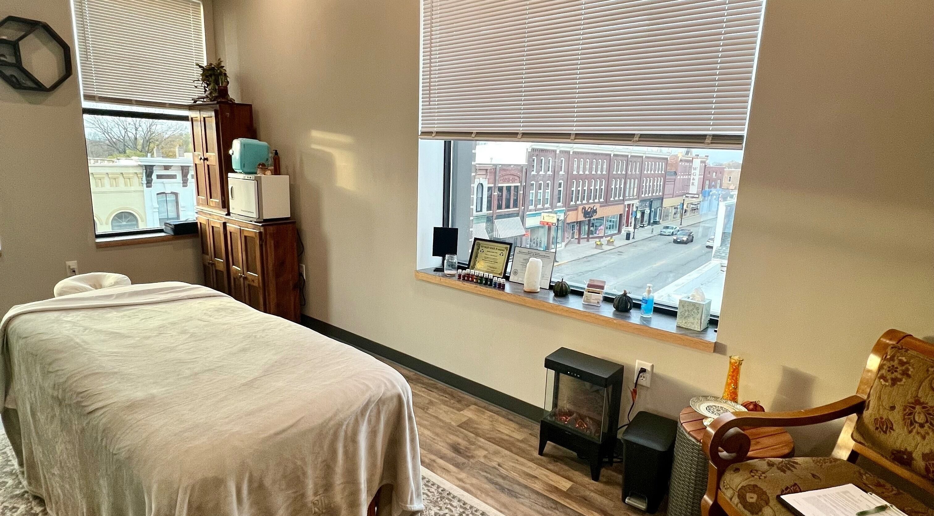 Cozy massage room at Body Alchemy Massage LLC in Fond Du Lac, Wisconsin, US with a street view.