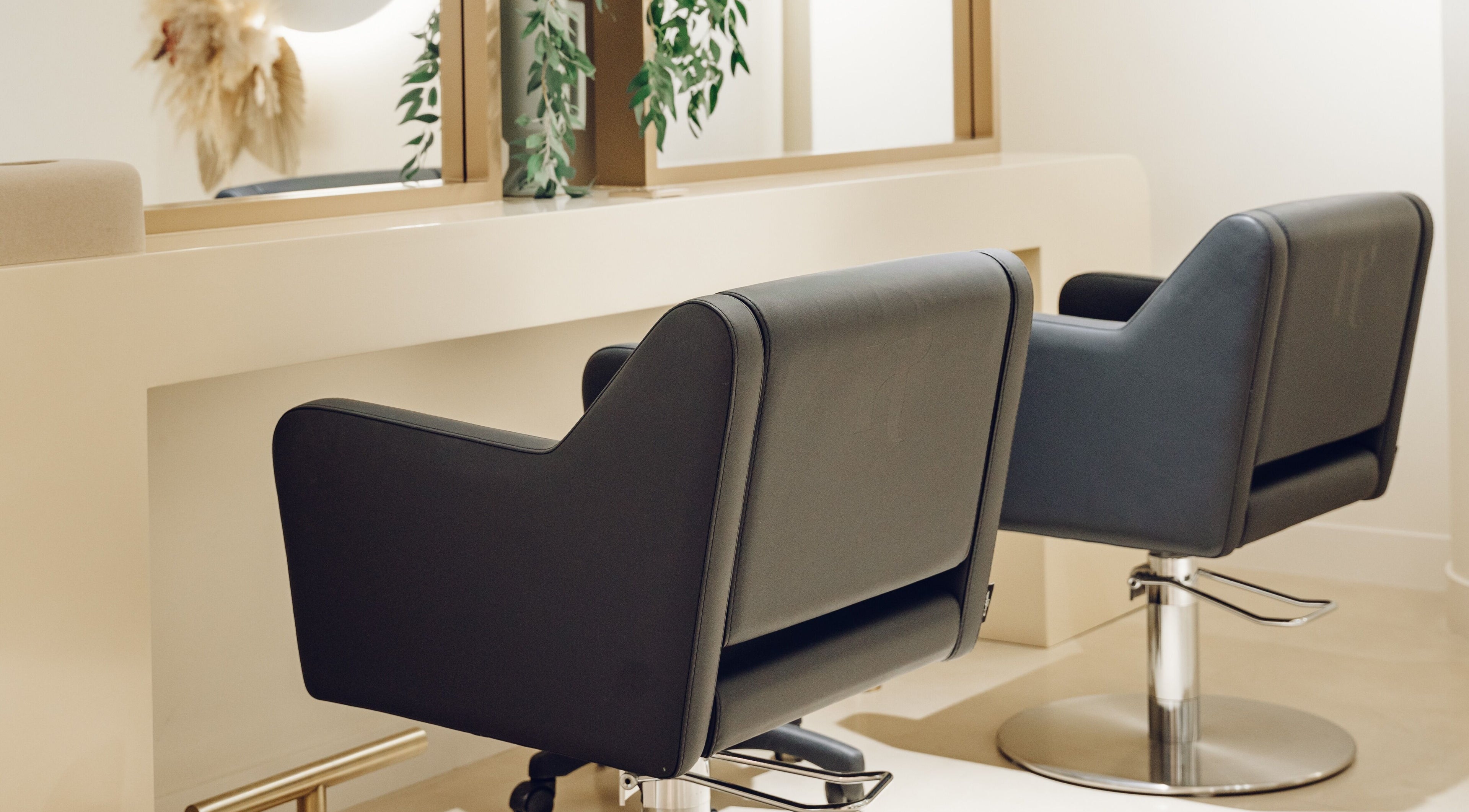 Modern salon chairs at The Hideaway in Dubai, AE, enhancing beauty and comfort.