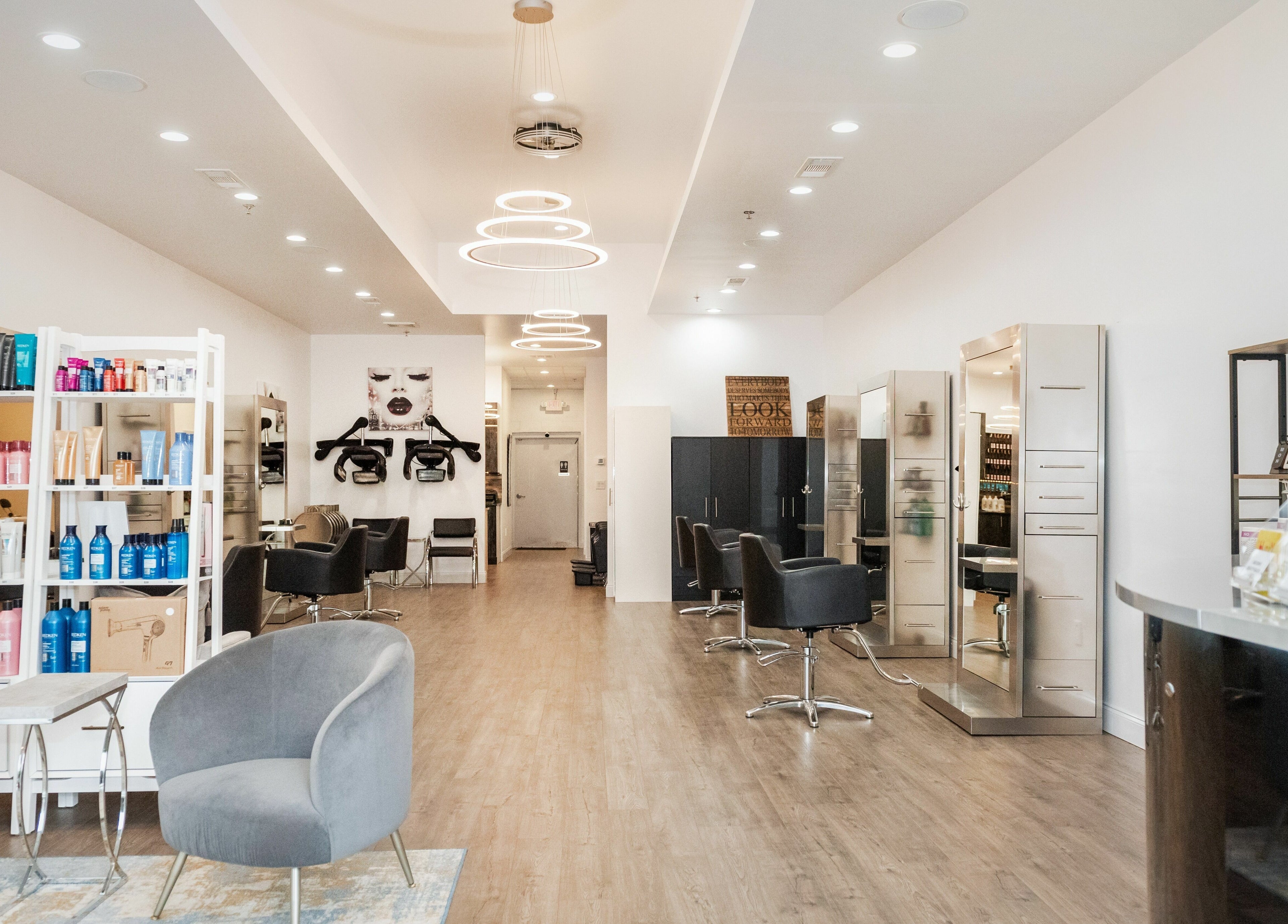 Modern interior of Moochini Hair Salon, Alpharetta, Georgia, US, with sleek furnishings and vibrant products.
