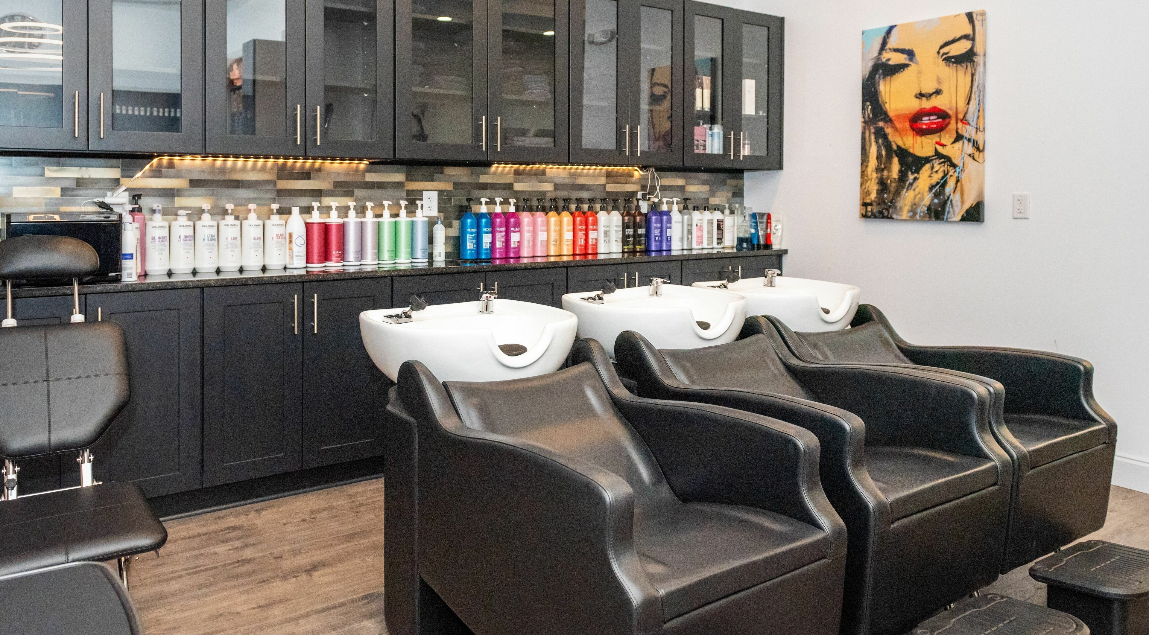 Moochini Hair Salon in Alpharetta, Georgia, US features stylish hair washing stations and vibrant product display.