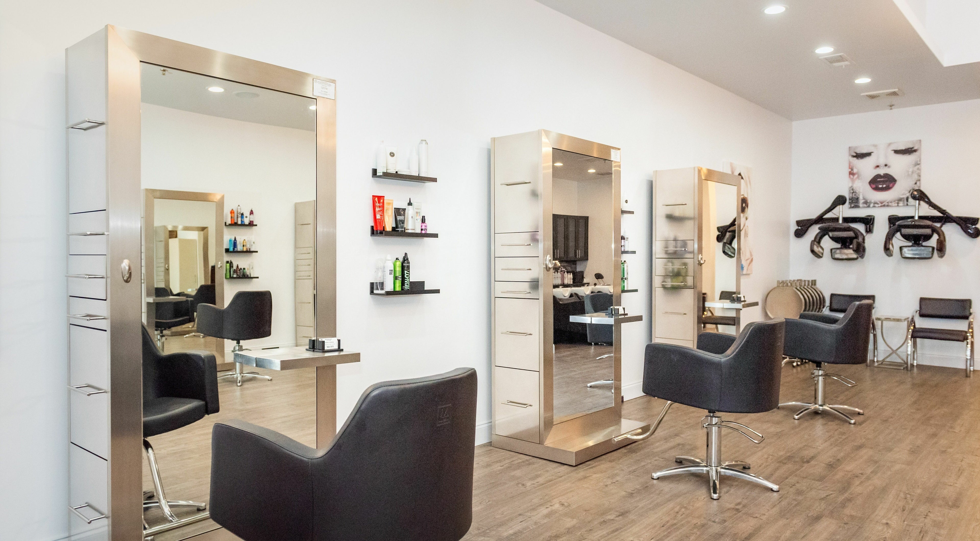 Elegant interior of Moochini Hair Salon in Alpharetta, Georgia, US, featuring sleek styling stations.