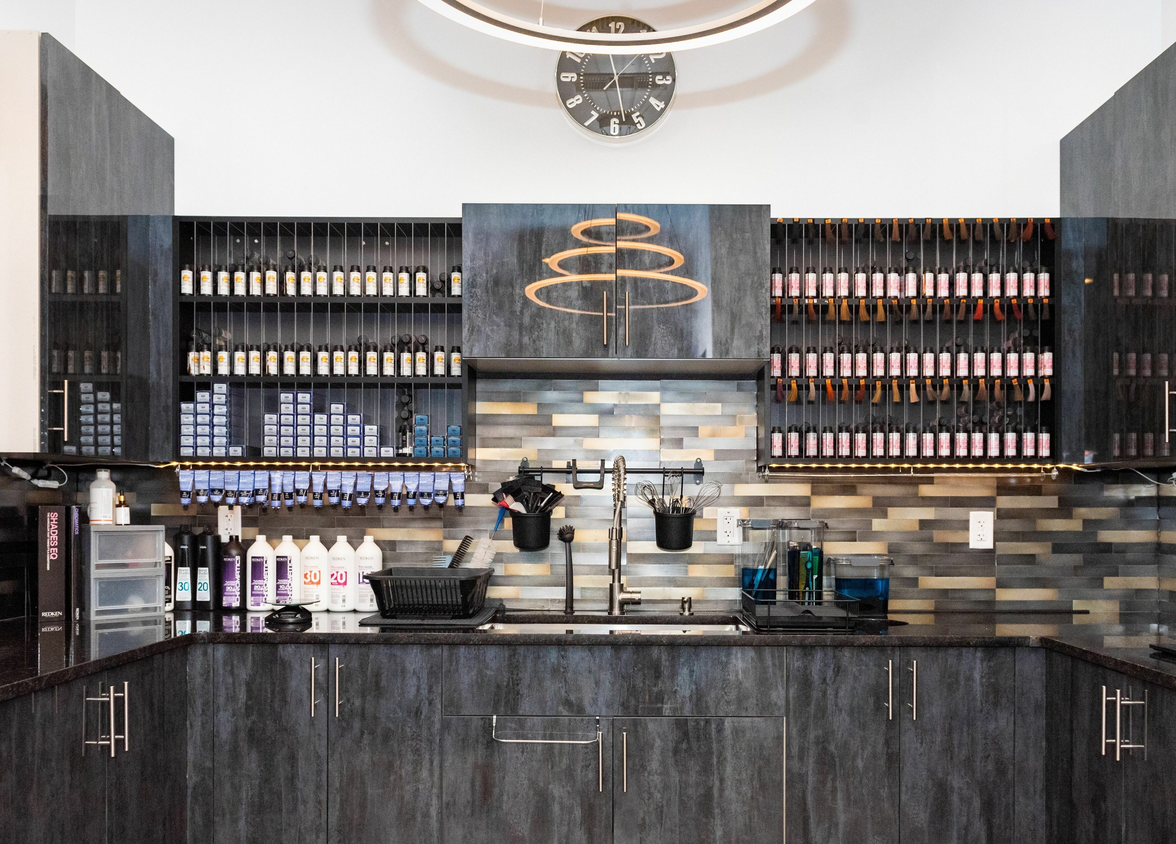 Color station at Moochini Hair Salon, Alpharetta, Georgia, US with vibrant hair dye displays.