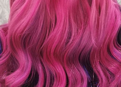 Vibrant pink and purple hair styled at Platinum Salon Rothwell - Lengths by Nathalie in Rothwell, England, GB.