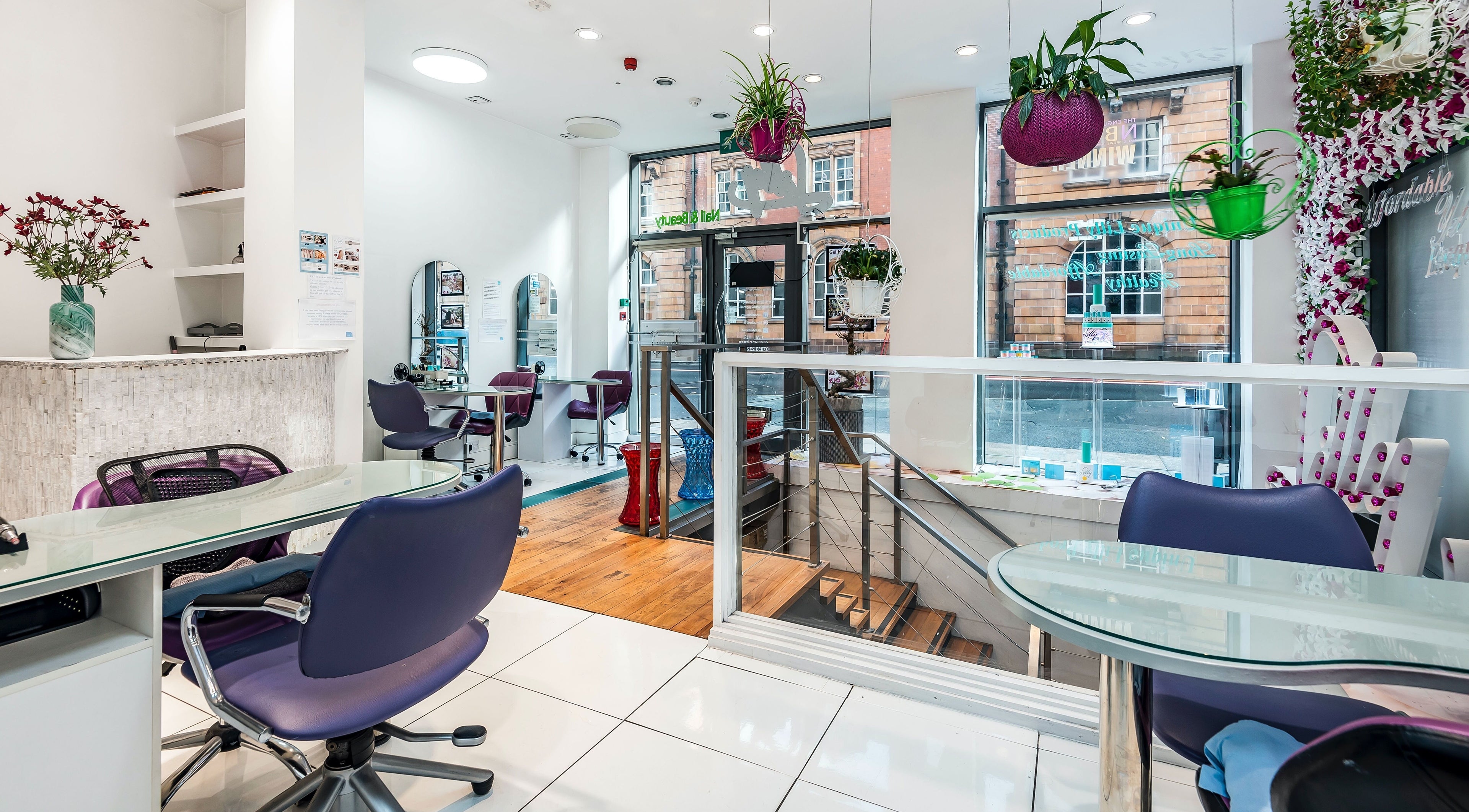 Bright interior of Lilly Nail & Beauty Manchester, featuring stylish decor and modern seating in Manchester, England, GB.