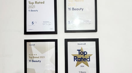 Yi Beauty awards display in London, England, GB showcasing Top Rated certificates from 2021 to 2024.