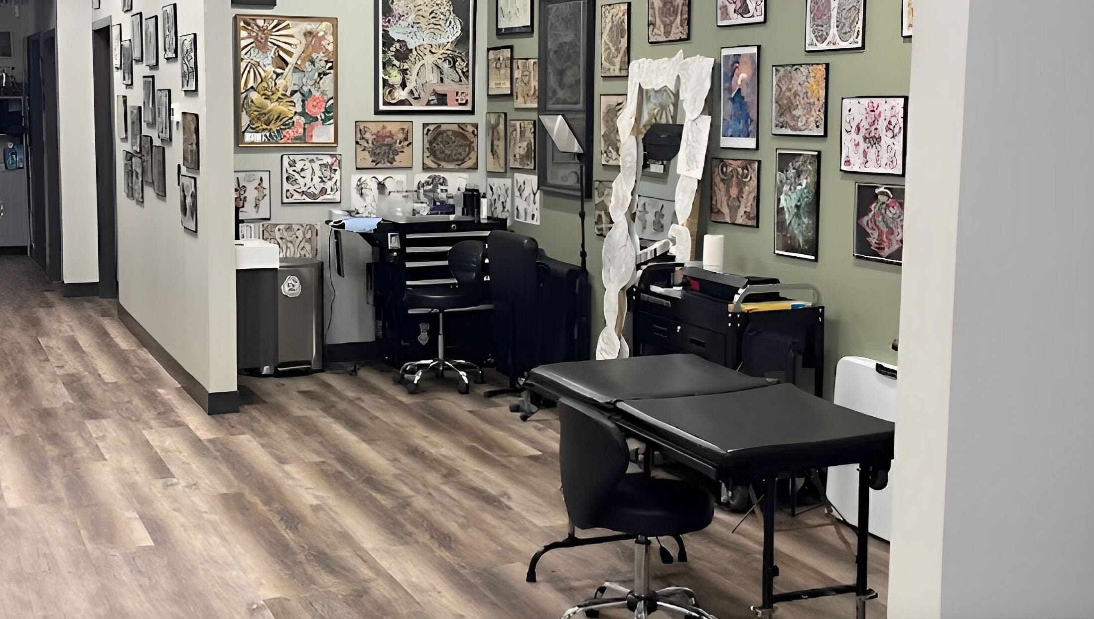 Tattoo room at Golden Cobra Tattoo and Piercing in Fridley, Minnesota, US, featuring artwork and equipment.