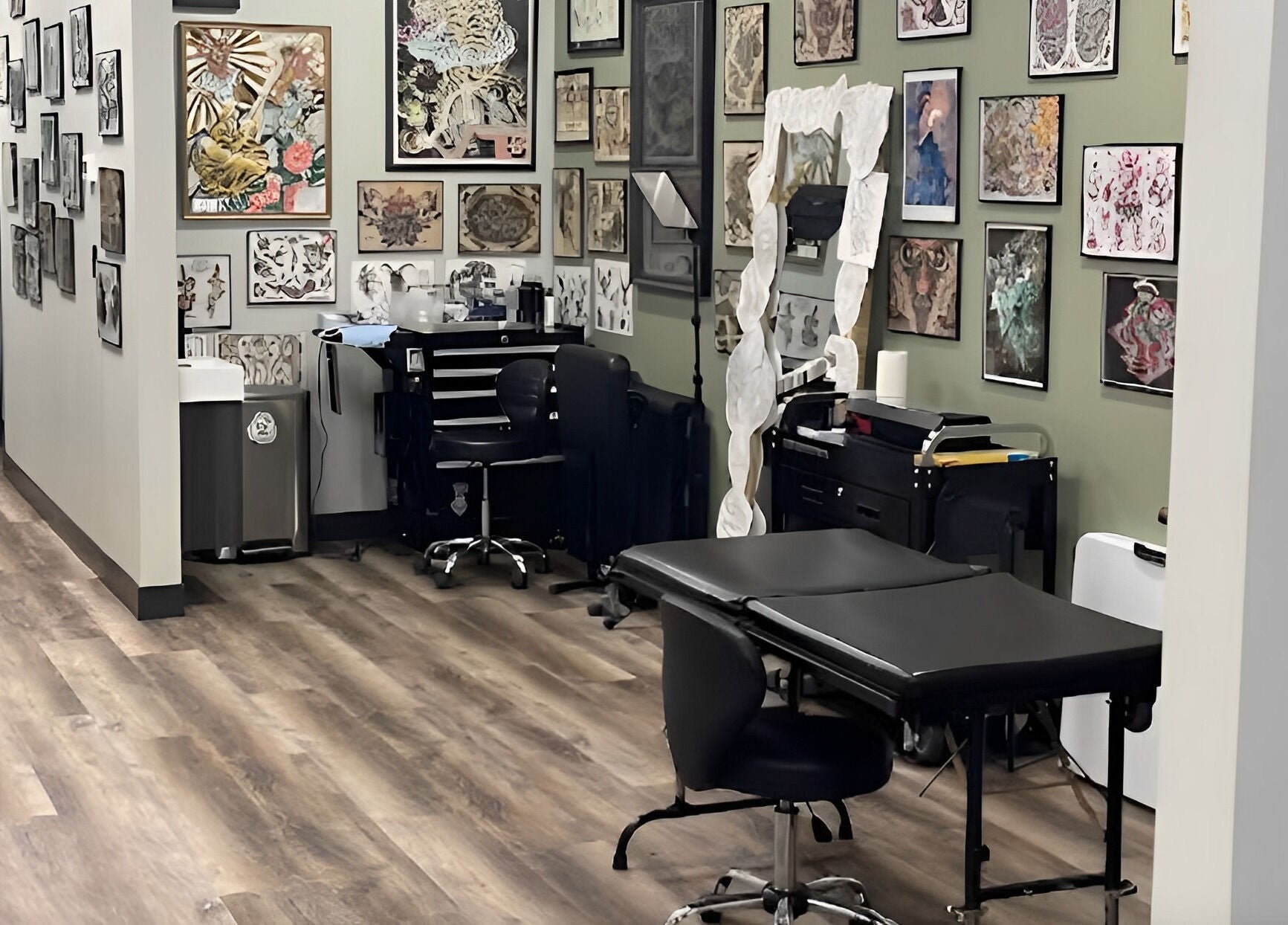 Tattoo room at Golden Cobra Tattoo and Piercing in Fridley, Minnesota, US, featuring artwork and equipment.