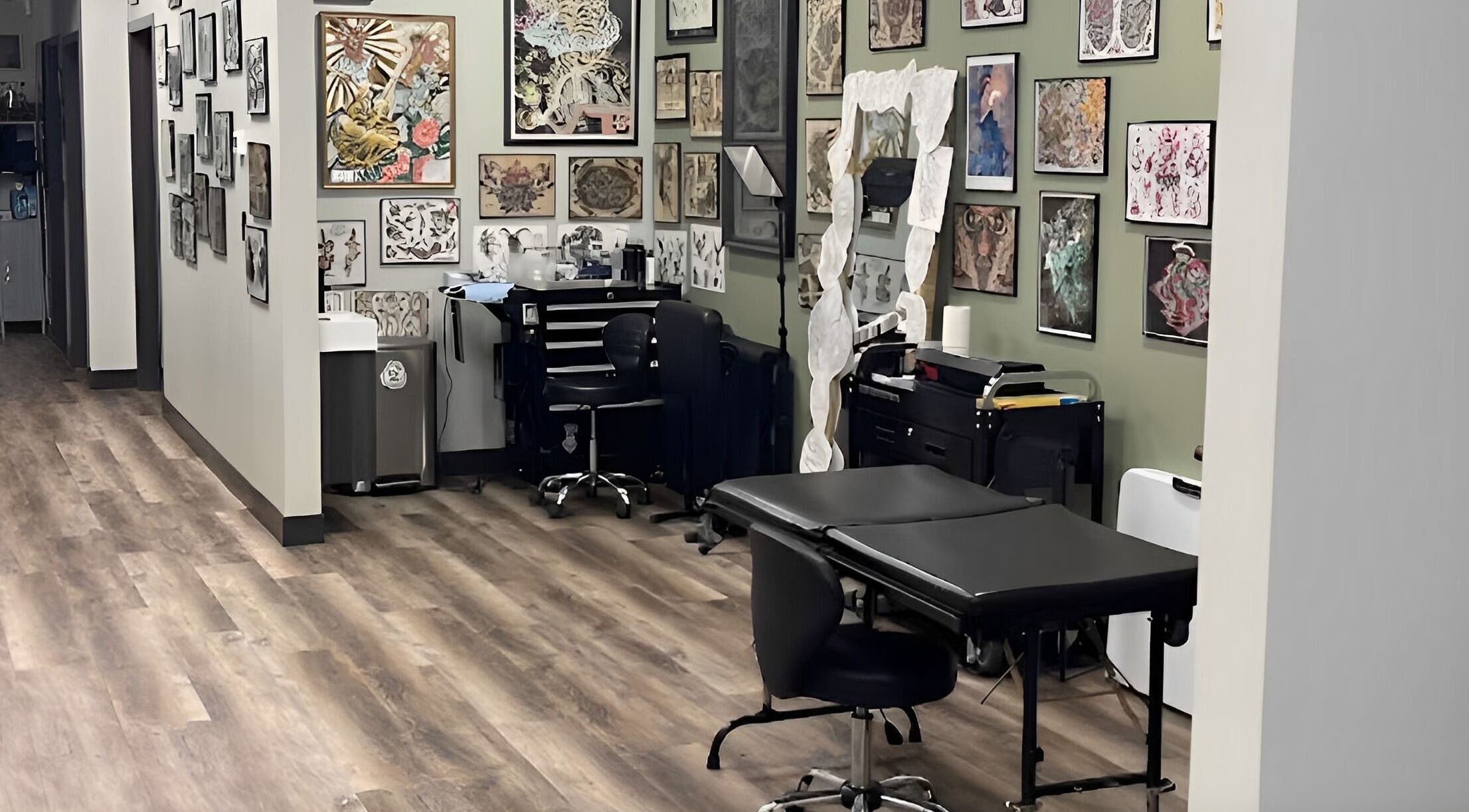 Tattoo room at Golden Cobra Tattoo and Piercing in Fridley, Minnesota, US, featuring artwork and equipment.