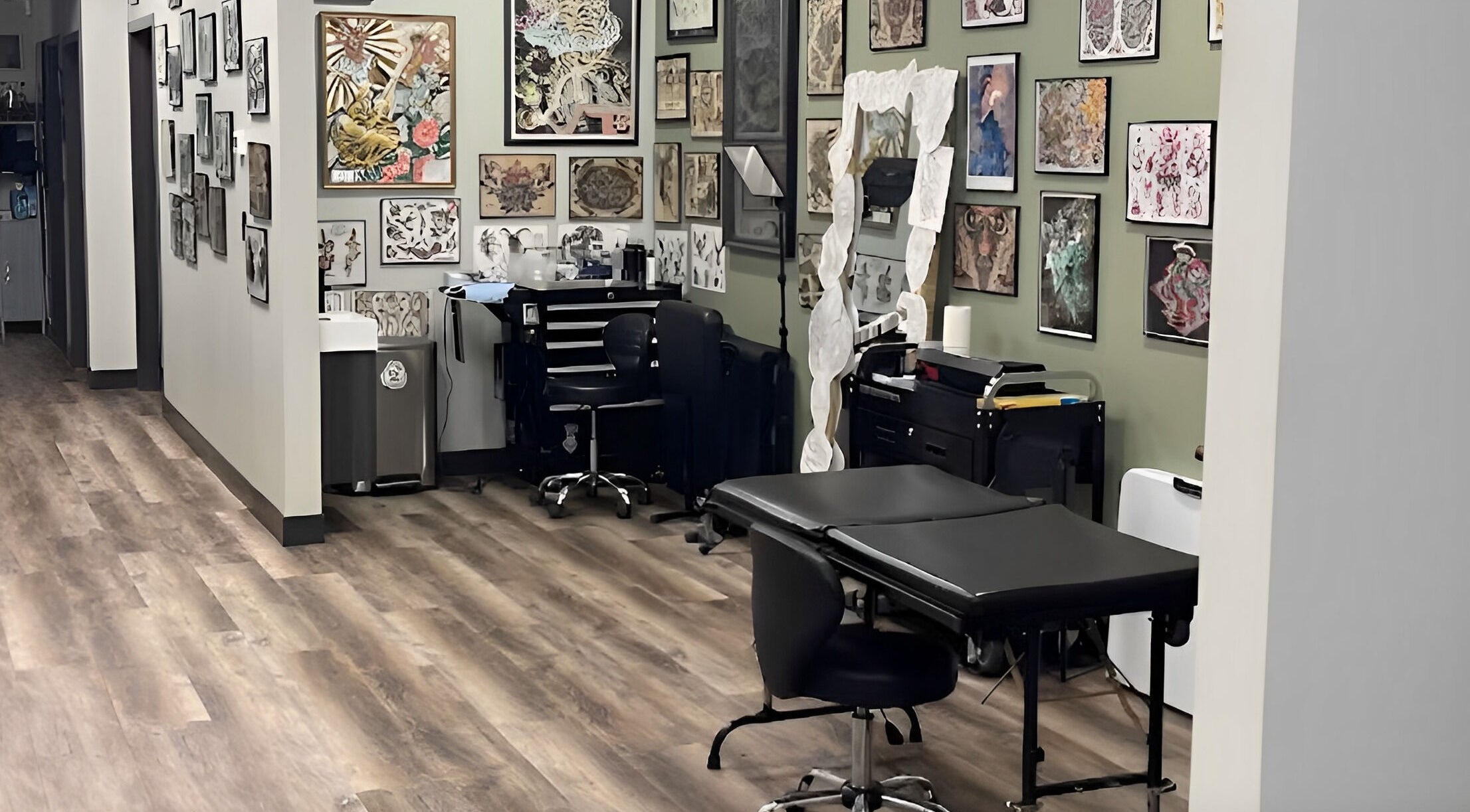 Tattoo room at Golden Cobra Tattoo and Piercing in Fridley, Minnesota, US, featuring artwork and equipment.