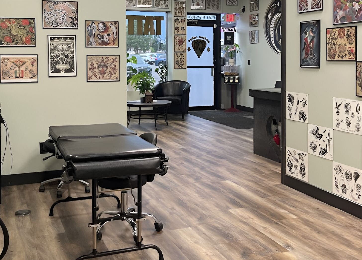 Interior of Golden Cobra Tattoo and Piercing, Fridley, Minnesota, US, showcasing tattoo art and seating.