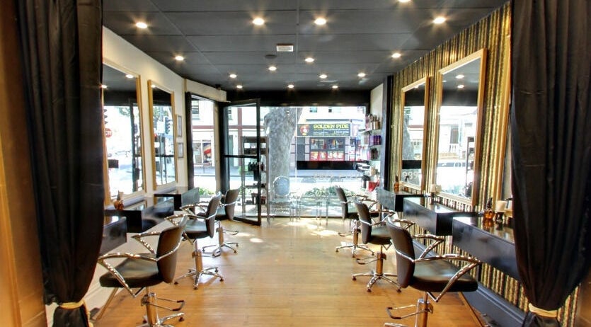 Chic interior of Minx Hair Studio, Surry Hills, featuring modern styling chairs in Surry Hills, New South Wales, AU.