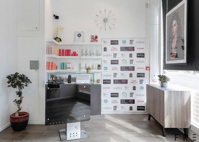 Reception area of Naya Hair & Beauty featuring modern decor and products in London, England, GB.