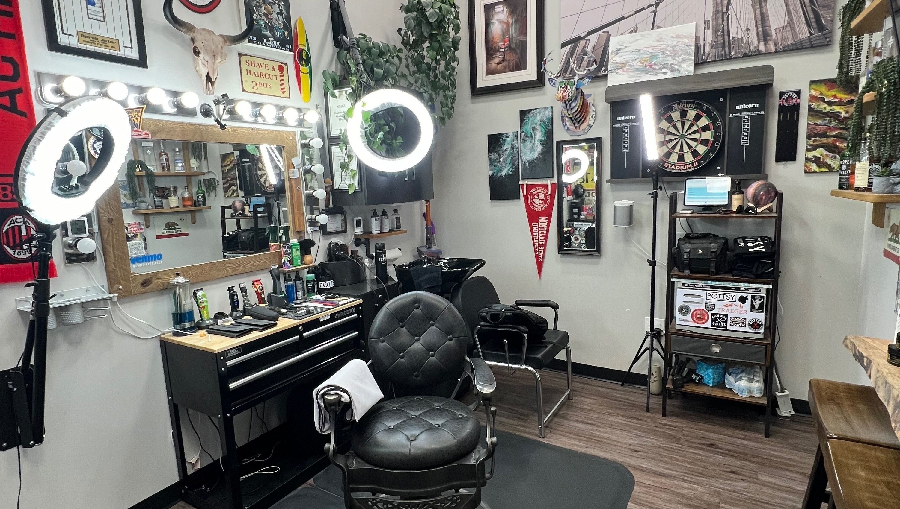 Modern setup of Pottsy Barber Suite in Cinnaminson, New Jersey, US showcasing stylish chairs and lighting.