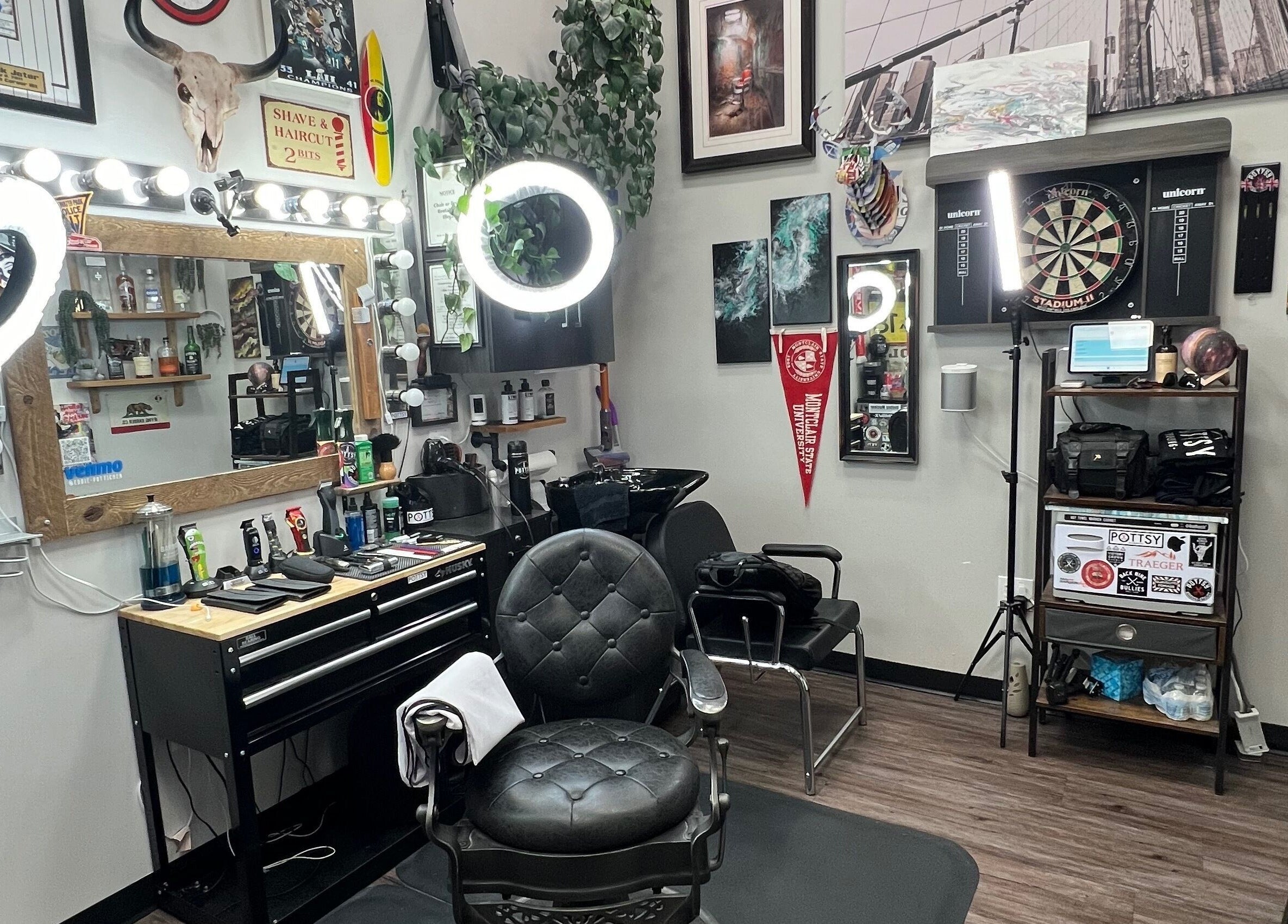 Modern setup of Pottsy Barber Suite in Cinnaminson, New Jersey, US showcasing stylish chairs and lighting.