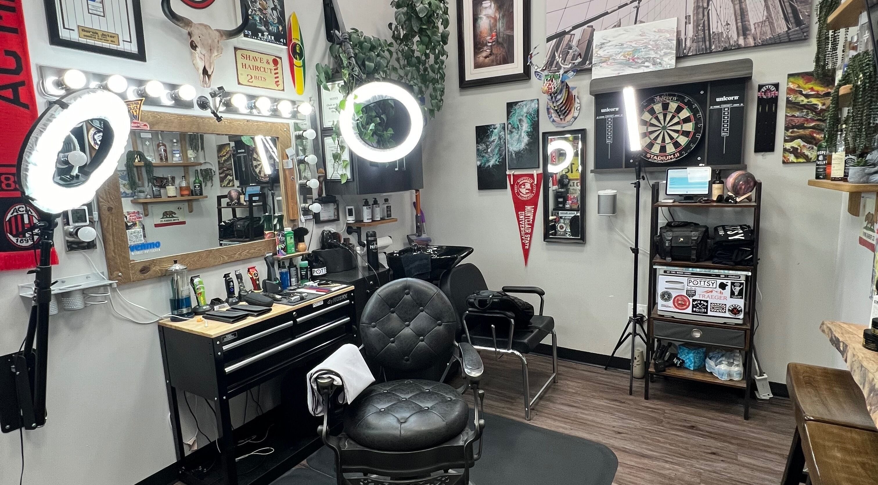 Modern setup of Pottsy Barber Suite in Cinnaminson, New Jersey, US showcasing stylish chairs and lighting.