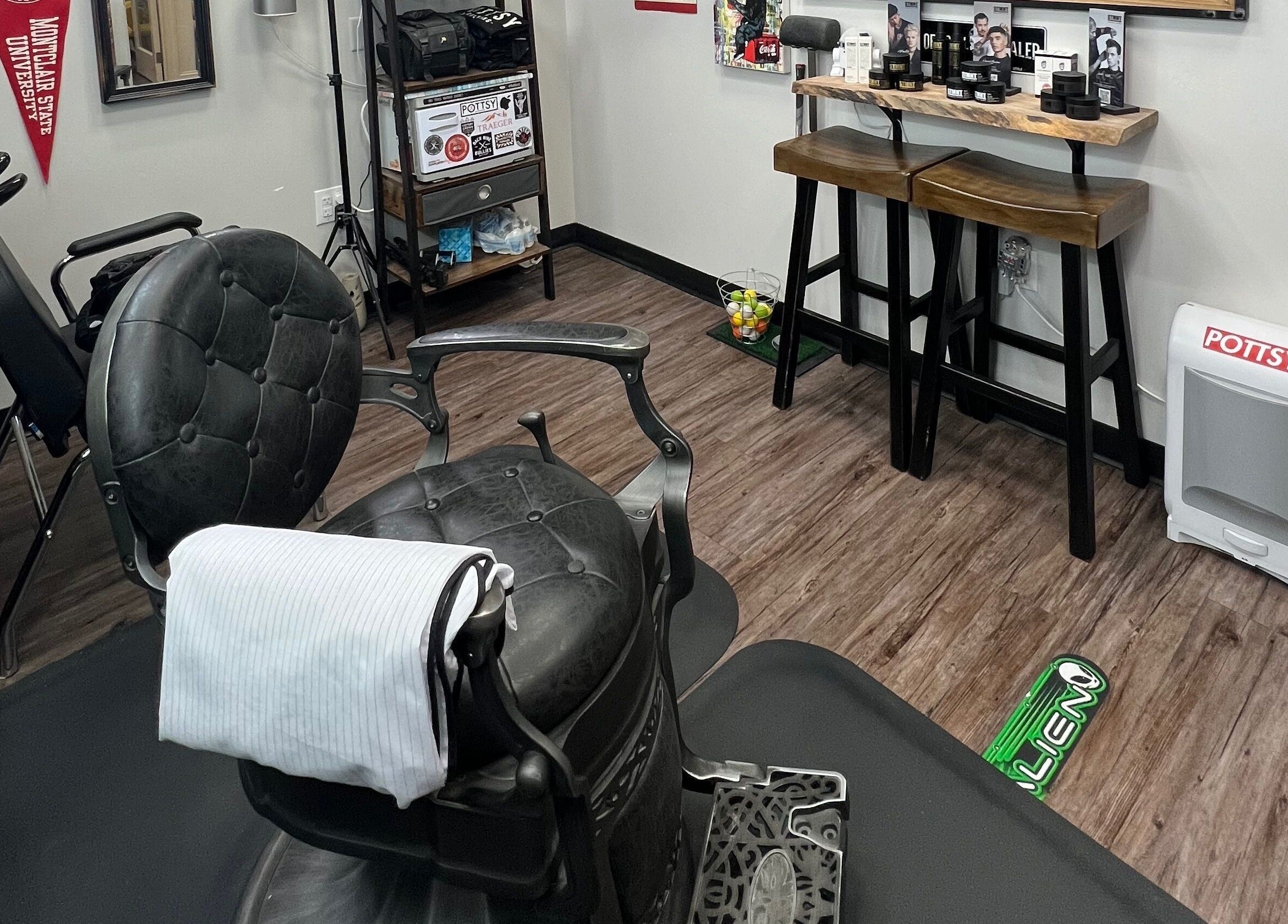 Elegant barber chair inside Pottsy Barber Suite, Cinnaminson, New Jersey, US, showcasing refined decor.