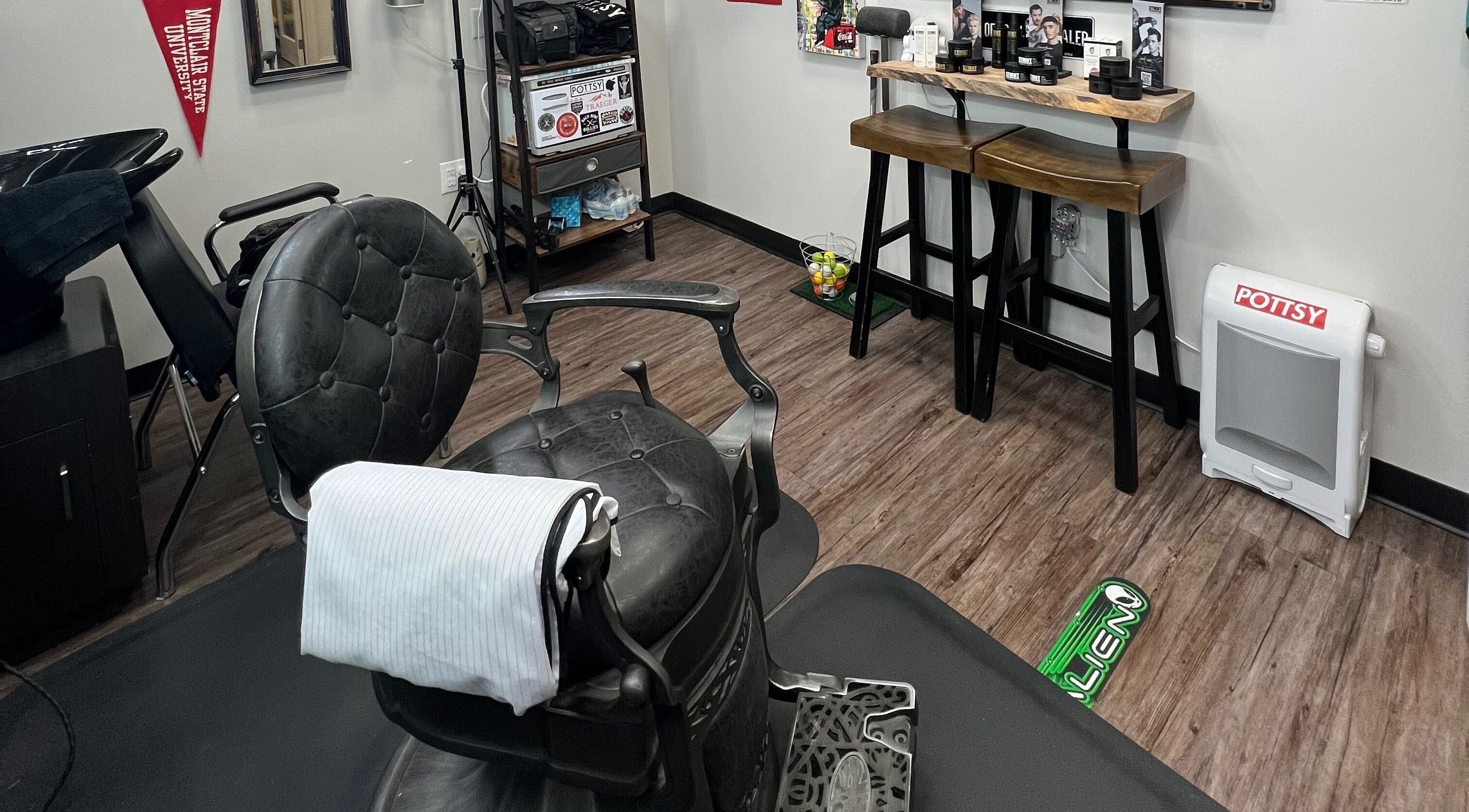 Elegant barber chair inside Pottsy Barber Suite, Cinnaminson, New Jersey, US, showcasing refined decor.