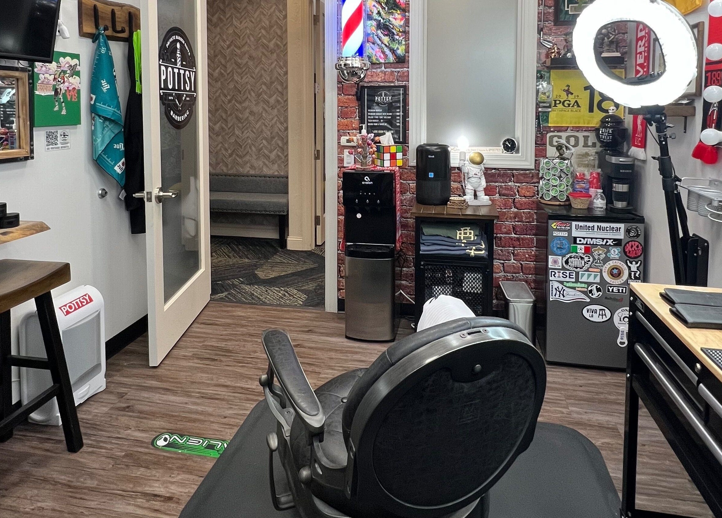 Modern interior of Pottsy Barber Suite in Cinnaminson, New Jersey, US showcasing a stylish barber chair and decor.